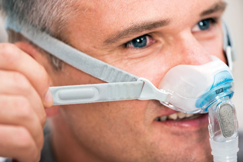 man wearing brevida nasal pillow mask