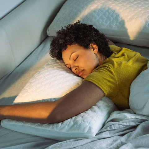 woman sleeping on her stomach on the Adjustable Shredded Memory Foam Pillow